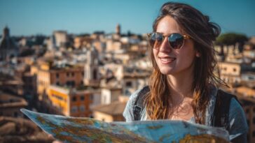 Young traveler holding a map with a city skyline in the background